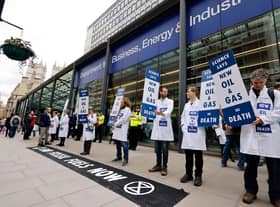 Activists from the climate change protest group Extinction Rebellion demonstrate outside of the Department for Business, Energy and Industrial Strategy in London (Picture: Tolga Akmen/AFP via Getty Images)