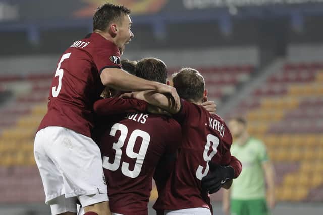 Lukas Julis celebrates with teammates after scoring his sides third goal. Picture: AP