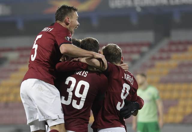 Lukas Julis celebrates with teammates after scoring his sides third goal. Picture: AP