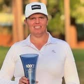 Ayrshire-born Hailey Davidson shows off the trophy after winning the NXXT Women's Classic in Florida. Picture: NXXT Golf