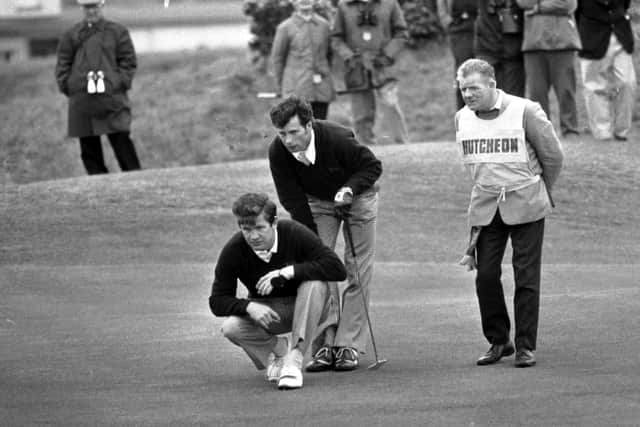 Ian Hutcheon offers his Great Britain & Ireland team-mate Pat Mulcare some advice about a putt during the 1975 Walker Cup at St Andrews, where they beat Dick Siderowf and Jerry Pate. Picture: TSPL