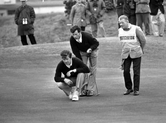 Ian Hutcheon offers his Great Britain & Ireland team-mate Pat Mulcare some advice about a putt during the 1975 Walker Cup at St Andrews, where they beat Dick Siderowf and Jerry Pate. Picture: TSPL