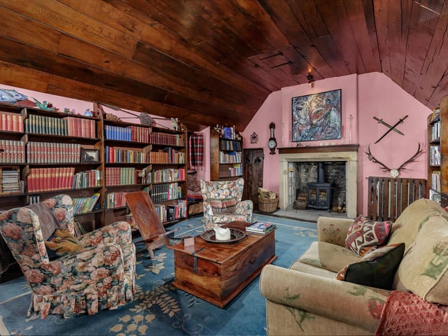 Interior: Its sitting room boasts a arched fireplace from the 16th-Century, while an Aga and Belfast sink present traditional comfort in the ground-floor kitchen. The first floor features a drawing room, dining room and master bedroom. A library and three bedrooms lie on the top storey.
