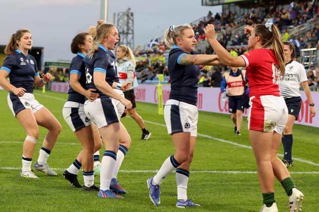 Scotland's Chloe Rollie (C) and Wales' Kayleigh Powell (R) exchange words during the New Zealand 2021 Women's Rugby World Cup Pool A match between Wales and Scotland at Northland Events Centre in Whangarei on October 9, 2022. (Photo by Michael Bradley / AFP) (Photo by MICHAEL BRADLEY/AFP via Getty Images)