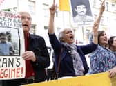Supporters of the People's Mojahedin of Iran protest outside a Stockholm court on the first day of the trial of an Iranian man for war crimes over the execution of political prisoners in 1988 in Karaj, Iran (Picture: Stefan Jerrevang/TT NEWS AGENCY/AFP via Getty Images)