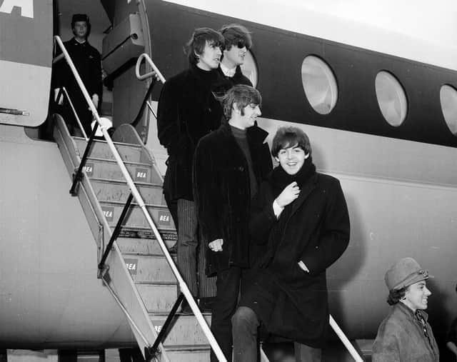 The Beatles arrive at Turnhouse in 1964 - The Beatles stand on the steps of their plane.