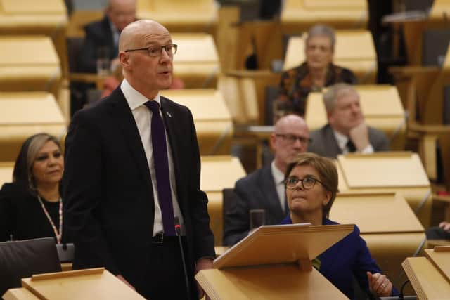 Deputy First Minister John Swinney MSP watched by First Minister Nicola Sturgeon as he delivered his budget to the Scottish Parliament.