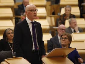 Deputy First Minister John Swinney MSP watched by First Minister Nicola Sturgeon as he delivered his budget to the Scottish Parliament.