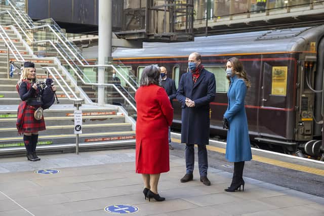 The royal couple were met by Deputy Lord Lieutenant Sandra Cumming and piper Louise Marshall when they arrived at Edinburgh's Waverley Station (Picture: Andy Barr/WPA pool/Getty Images)