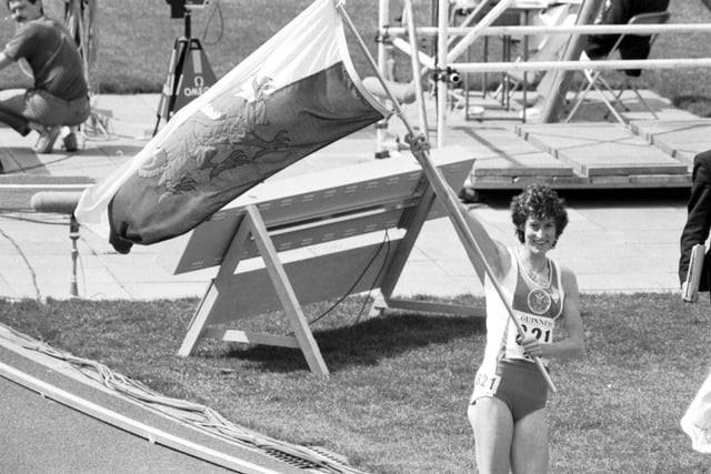 Gold medal winner Kirsty Wade waves the Welsh flag after winning the Women's 1500m final in the 1986 Commonwealth Games at Meadowbank stadium in Edinburgh.