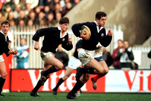 Gavin Hastings is a picture of concentration as he heads for the line during the 1995 Five Nations win over France. It was Scotland's first win in Paris for 26 years and was achieved in the most dramatic of circumstances. Before Hastings' thrilling late try, France had taken the lead with eight minutes remaining when Philippe Saint-Andre took advantage of a poor clearance from Gregor Townsend. The current Scotland coach made up for the error with his memorable assist.