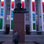 Oxana stands before a statue of Lenin in Tiraspol. Picture: Henry Worsley