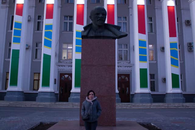 Oxana stands before a statue of Lenin in Tiraspol. Picture: Henry Worsley