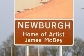The project team erected two threshold road signs honouring McBey at either end of Newburgh.