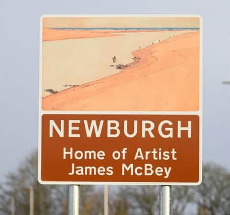The project team erected two threshold road signs honouring McBey at either end of Newburgh.