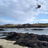 The Coast Guard helicopter winches the casualty from Mull to safety on the mainland (Photo: Craignure Coastguard Rescue Team).