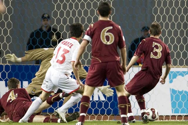 Georgia's David Siradze (2nd left) manages to get in between the Scotland defence to score his side's second of the game in the Euro 2008 qualifier.