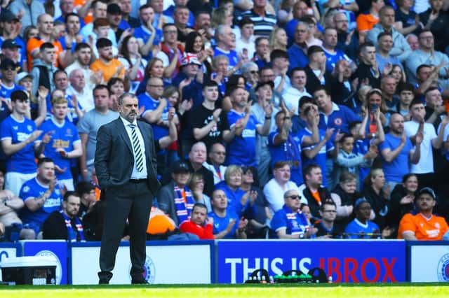 Celtic manager Ange Postecoglou watches on at Ibrox as his team go down 3-0 to Rangers.