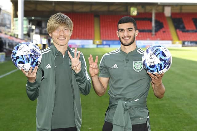 Celtic's latest hat-trick scorer Kyogo Furuhashi and Liel Abada may be thankful for the multi-ball era as they hold the spoils for their triples in the 9-0 demolition of Dundee United.  (Photo by Rob Casey / SNS Group)