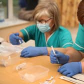 Health care assistant Paula Kirlew (right) and Nurse Helen Abbatt (left) prepare the BioNTech/Pfizer Covid-19 vaccine for doctors to administer.