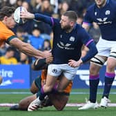 Finn Russell wows Murrayfield with another flipped offload under pressure.