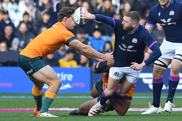 Finn Russell wows Murrayfield with another flipped offload under pressure.