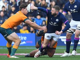Finn Russell wows Murrayfield with another flipped offload under pressure.