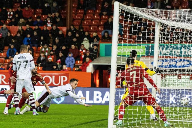 Lawrence Shankland put Hearts ahead with this diving header.