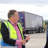 Stephen Mooney of Menzies Distribution with Richard Lochhead MSP at the new Elgin facility.