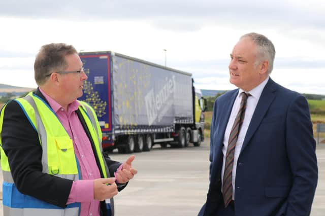 Stephen Mooney of Menzies Distribution with Richard Lochhead MSP at the new Elgin facility.