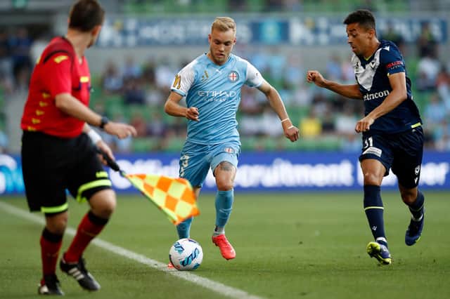 Nathaniel Atkinson of Melbourne City runs with the ball during the A-League match against Melbourne Victory at AAMI Park on December 18, 2021 (Photo by Darrian Traynor/Getty Images)