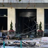 Debris are seen in front of the Radisson Blu hotel, where a huge aquarium located in the hotel's lobby burst this morning.