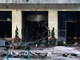 Debris are seen in front of the Radisson Blu hotel, where a huge aquarium located in the hotel's lobby burst this morning.