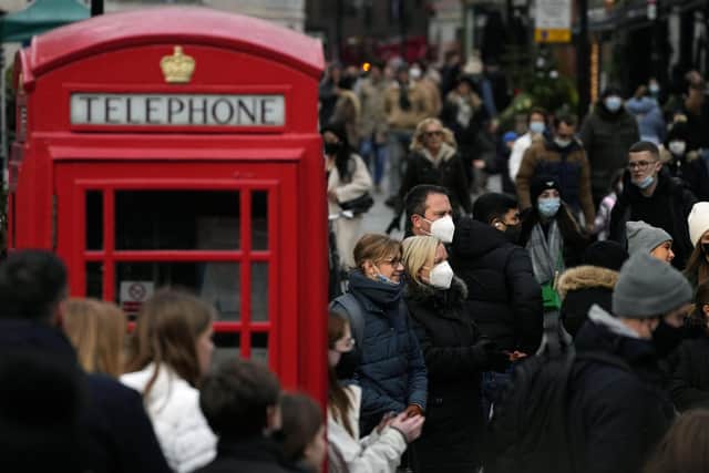 Shoppers do their last Christmas shopping in Covent Garden in London. Picture: AP Photo/Frank Augstein