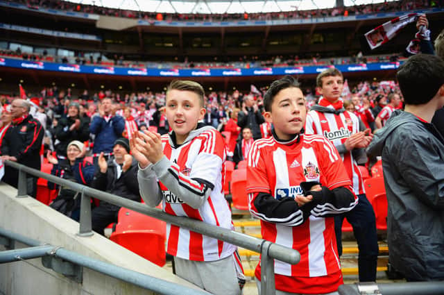 Young Sunderland fans look on prior to the Capital One Cup final between Manchester City and Sunderland at Wembley Stadium on March 2, 2014.