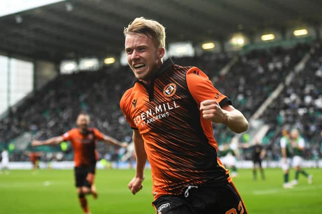 Dundee United's Kieran Freeman celebrates his goal in the 3-0 win over Hibs at Easter Road. (Photo by Ross MacDonald / SNS Group)