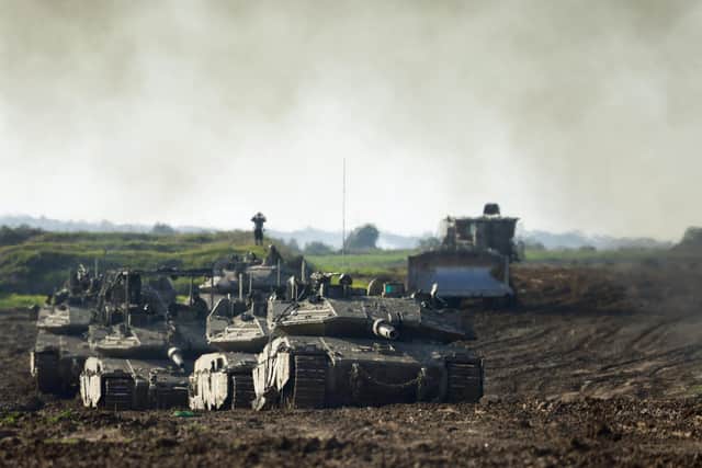 A picture taken from the Israeli border with Gaza shows an Israeli armoured vehicles convoy returning from the Palestinian territory. UK foreign secretary James Cleverly has said the organisation Hizb ut-Tahrir is 'anti-Semitic' and 'actively promotes and encourages terrorism, including praising and celebrating the appalling October 7 attacks'.
 Picture: Menahem Kahana/AFP via Getty Images