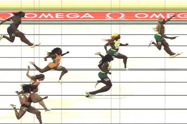 A photo released by Omega shows Jamaica's Elaine Thompson-Herah, right, celebrates after winning the women's 100m final at the Tokyo 2020 Olympic Games. Picture: AFP via Getty Images