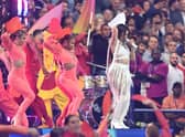 Fans look on as Camila Cabello performs in the pre-match show ahead of the Uefa Champions League final (Picture: David Ramos/Getty Images)