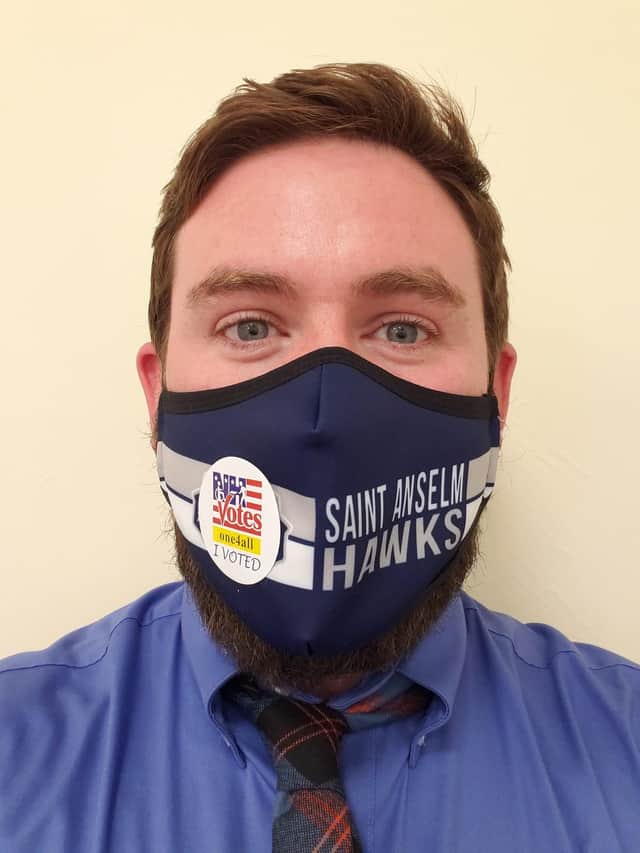 Dr Craig Gallagher, who became a US citizen in September 2019, shows off his voting sticker - and mask - after his first US election. Picture: Craig Gallagher