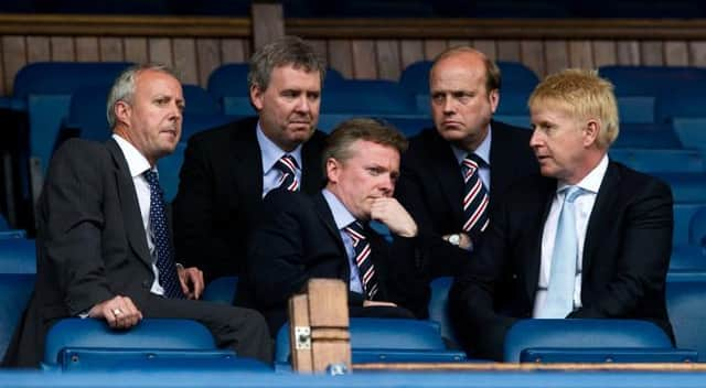 Four days after taking ownership of Rangers, Craig Whyte (centre) in discussion with (from left) David Grier, Gary Withey, Phil Betts and Donald Muir before a match against Dundee United at Ibrox. (Photo by Alan Harvey/SNS Group).