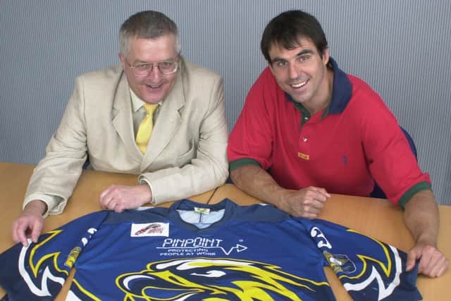 John Waring, left,  who launched Pinpoint, was also a director and team sponsor of Fife Flyers. He is pictured in 2001 with team captain Frank Morris