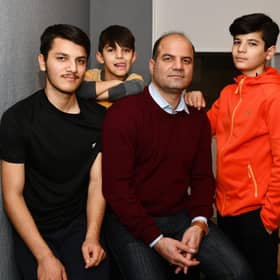 Sayed Zaman Hashemi and his family - Ramin Hashemi 17; Masih Hashemi 8; and Shahyad Hashemi 13 - who have fled from the Taliban in Afghanistan and are currently in Perth. Picture: Michael Gillen