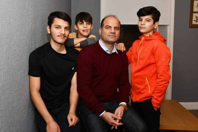 Sayed Zaman Hashemi and his family - Ramin Hashemi 17; Masih Hashemi 8; and Shahyad Hashemi 13 - who have fled from the Taliban in Afghanistan and are currently in Perth. Picture: Michael Gillen