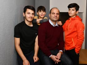Sayed Zaman Hashemi and his family - Ramin Hashemi 17; Masih Hashemi 8; and Shahyad Hashemi 13 - who have fled from the Taliban in Afghanistan and are currently in Perth. Picture: Michael Gillen