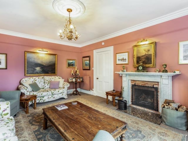 Sitting room with feature open fireplace.