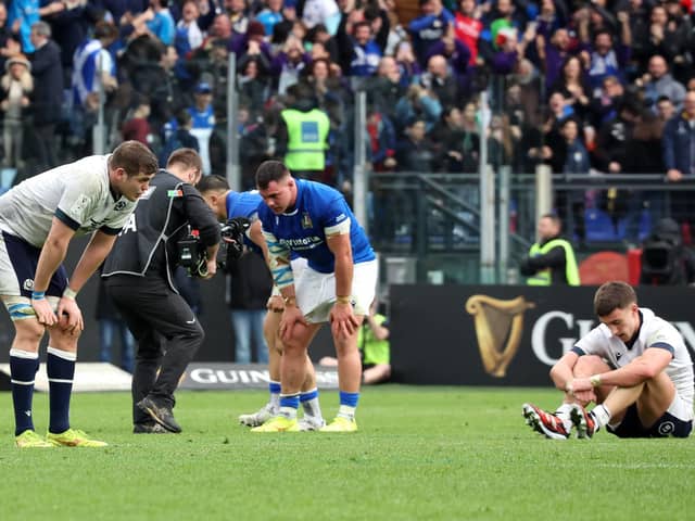 Scott Cummings and Cameron Redpath of Scotland look dejected following the team's defeat by Italy.