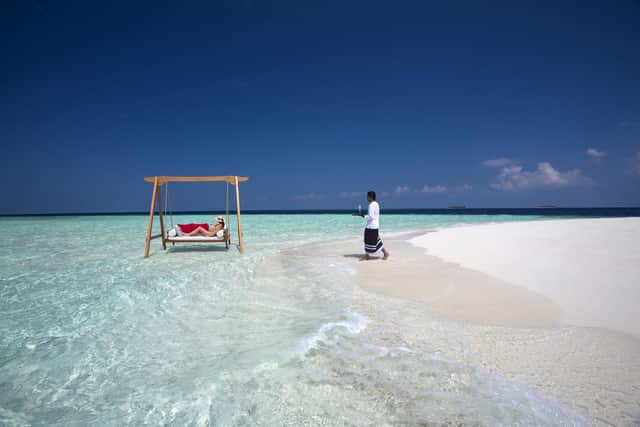 Relaxing on a sandbar at Baros resort. Pic: Baros/PA.