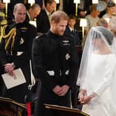 Prince William (left) watching Prince Harry and Meghan Markle during their wedding at St George's Chapel at Windsor Castle. Picture: Jonathan Brady/PA Wire