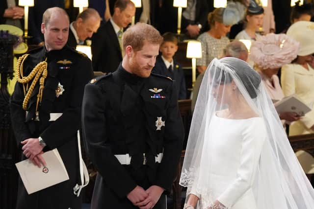 Prince William (left) watching Prince Harry and Meghan Markle during their wedding at St George's Chapel at Windsor Castle. Picture: Jonathan Brady/PA Wire